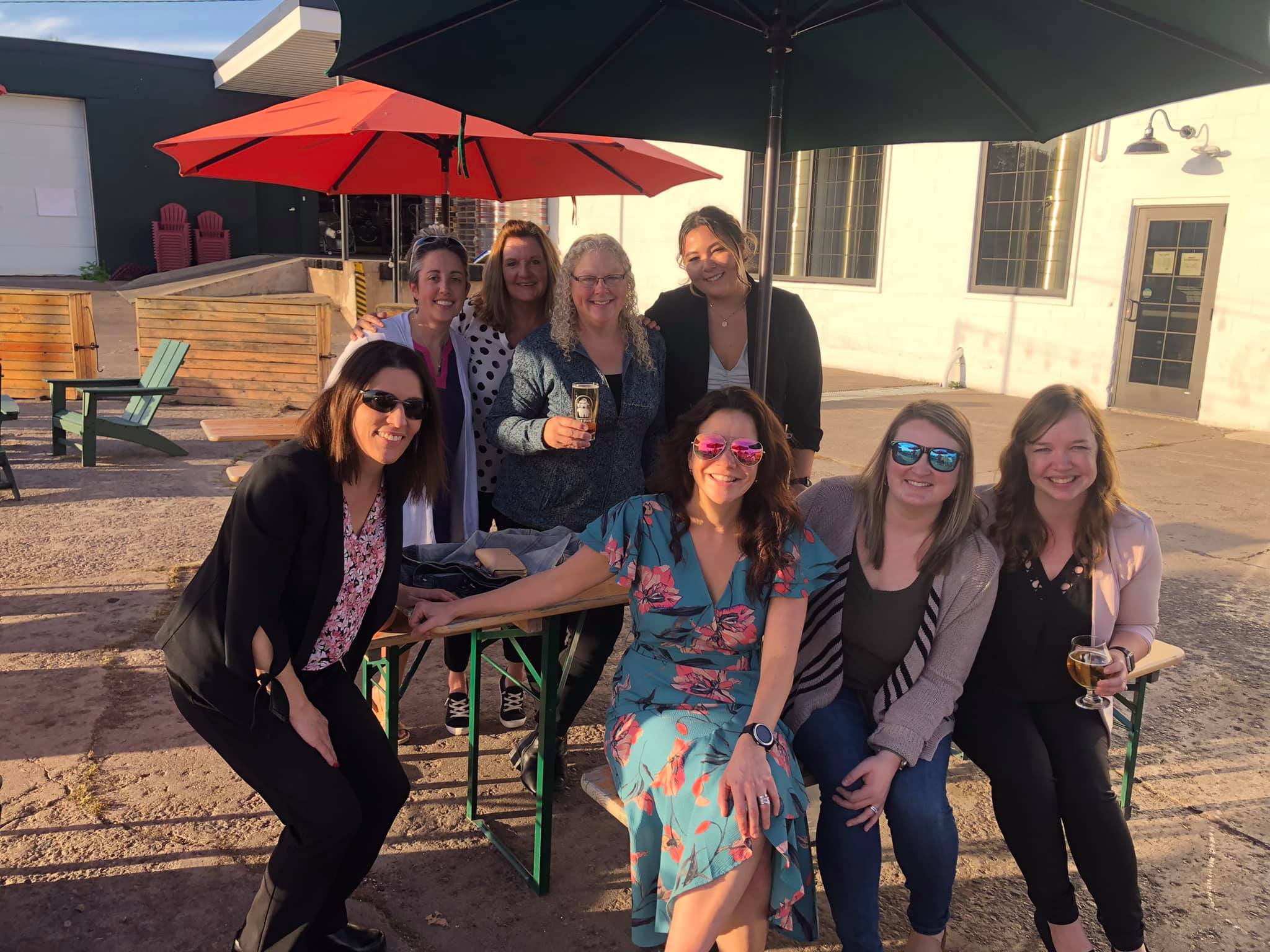 People sitting at a picnic table outside