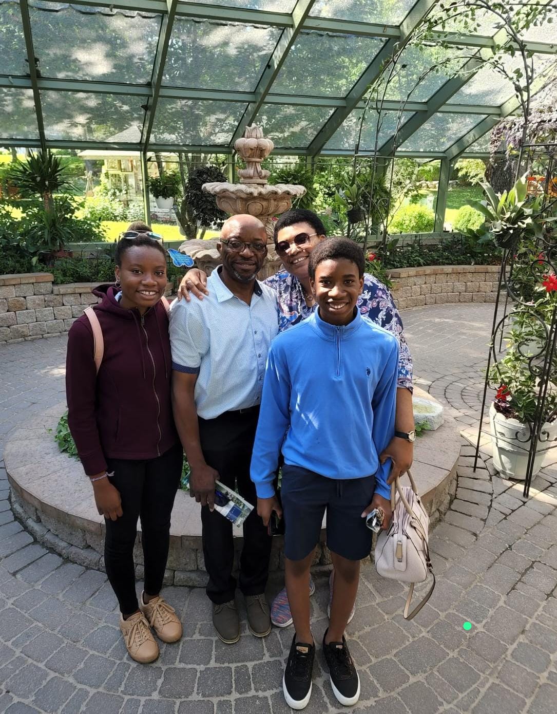 family picture in a greenhouse