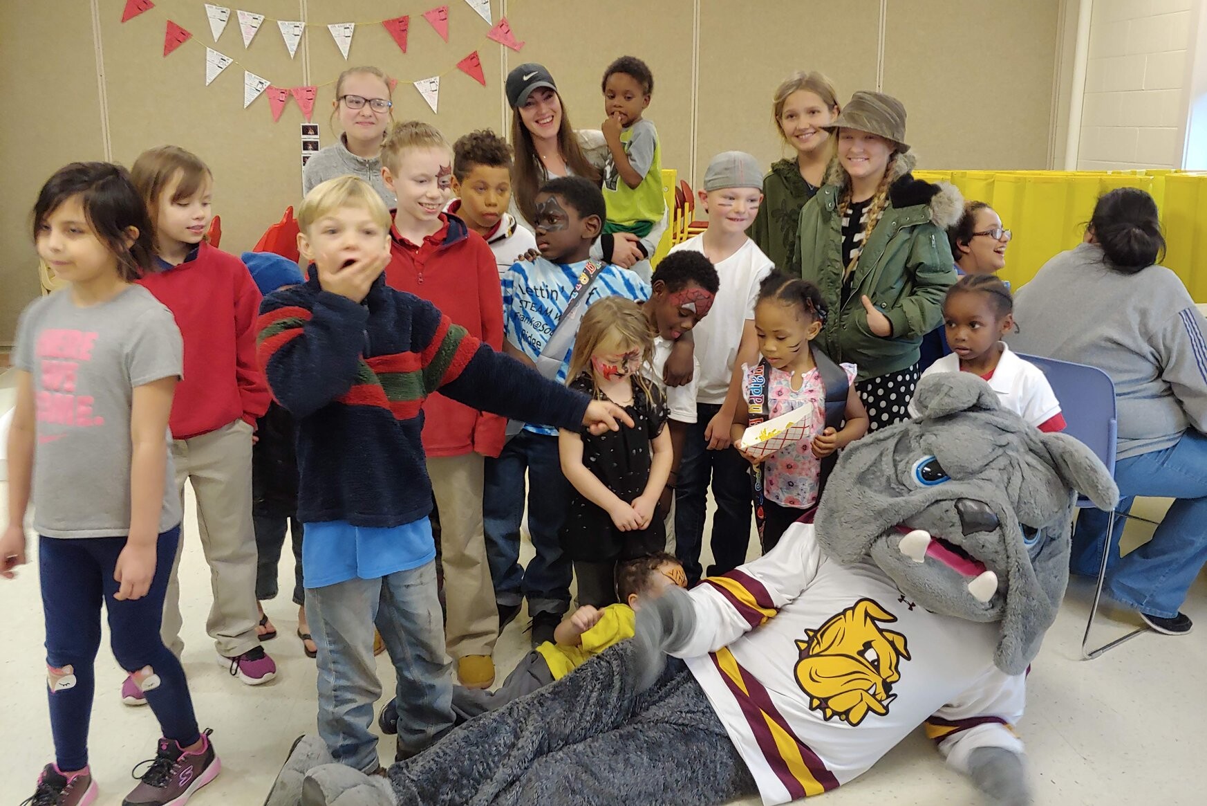 Kids Smiling with Champ from UMD Bulldogs