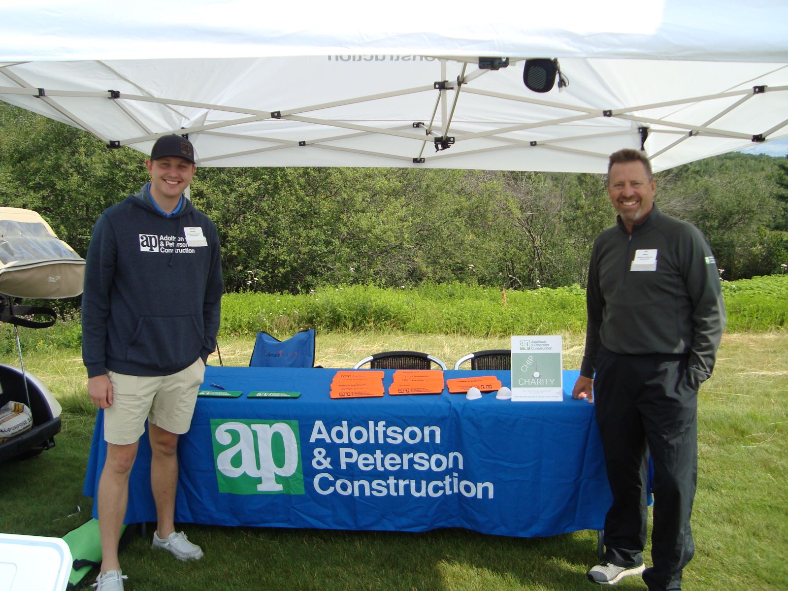 Adolfson and Peterson Construction booth at event